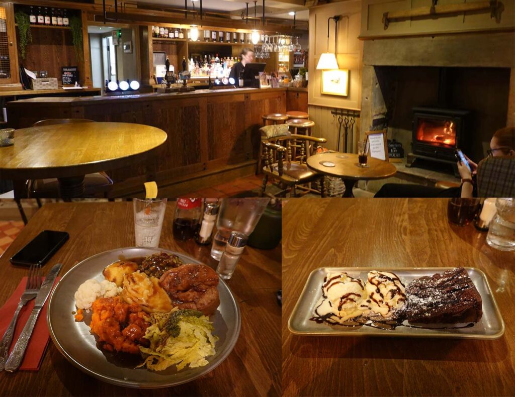 Interior of Ye Olde Cheshire Cheese Inn in Longnor, with a roaring fire, bar area and plates of pub food and dessert.