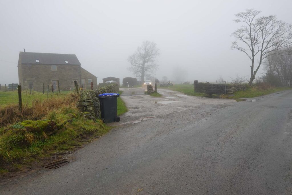 Misty rural road in Hollinsclough where walkers leave the lane to begin one of the classic Chrome Hill walks.